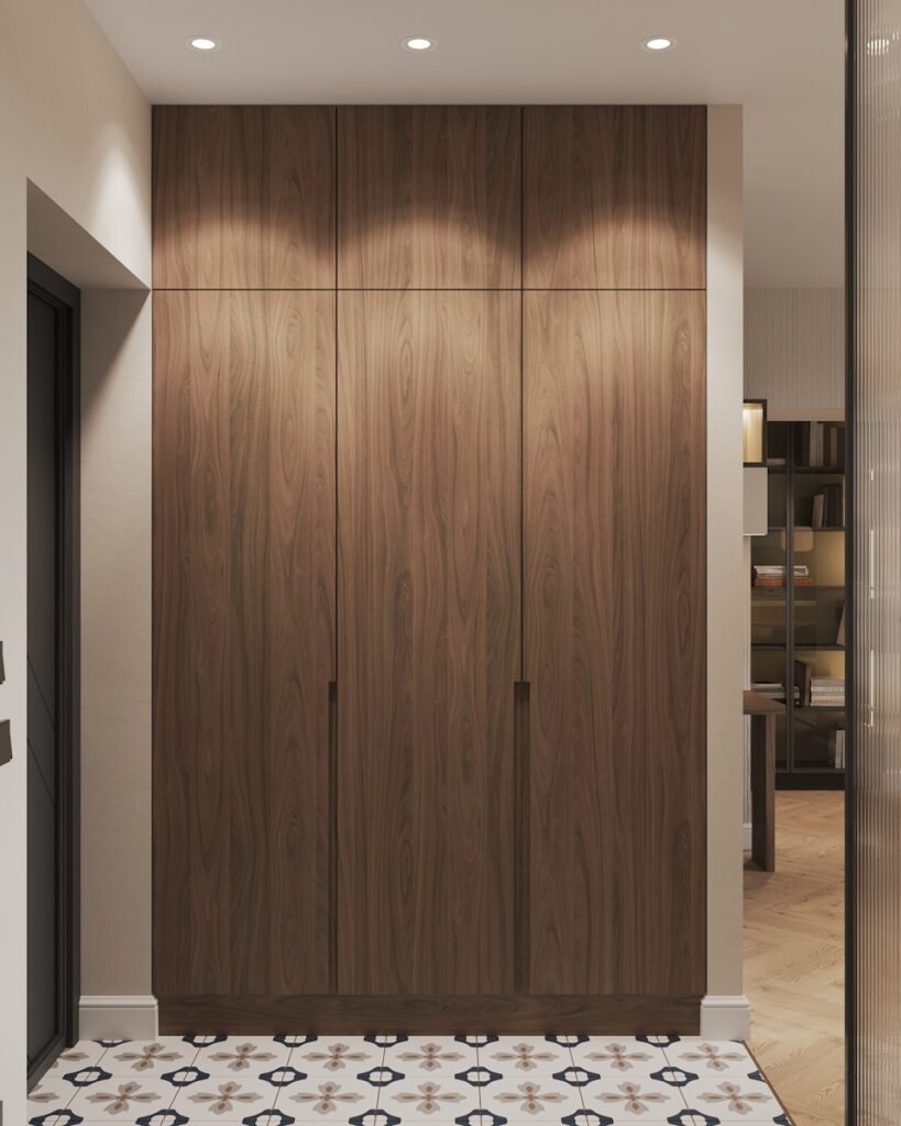 A room with a large wooden cabinet and a tiled floor
